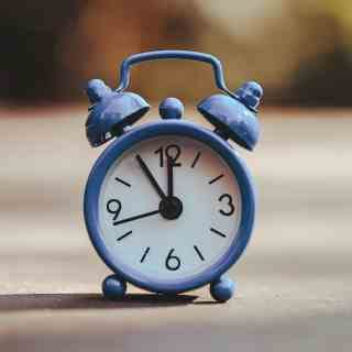 Clock showing the best time to take Mounjaro