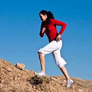 Woman climbing uphill