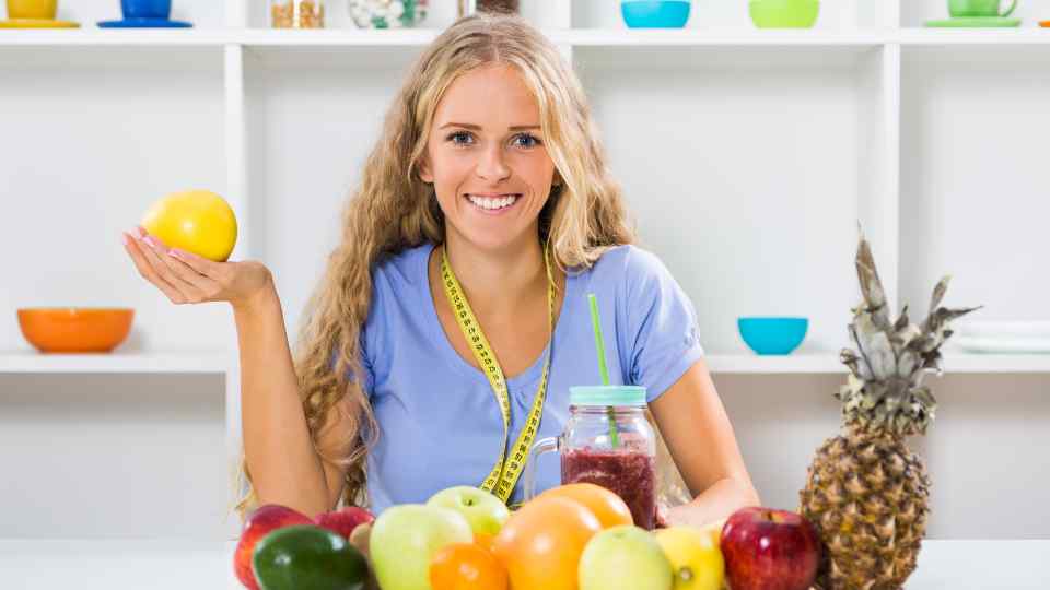 Woman using weight loss tools at home